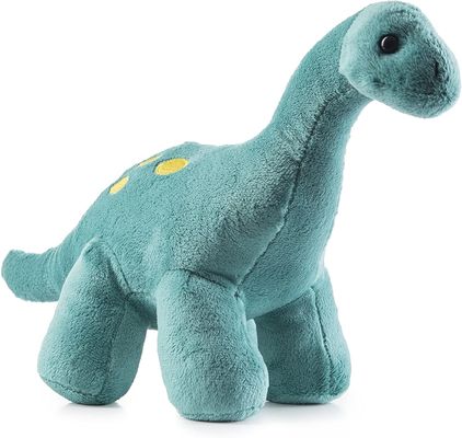 Grünes Tyrannosaurusplüschspielzeug mit den langen spitzen Zähnen ein Dinosaurierplüschspielzeug hergestellt von prägeartigem scherendem Plüsch